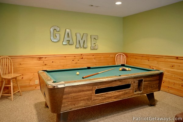 Green felted pool table in the game room at Alpine Sundance Trail, a 3 bedroom cabin rental located in Pigeon Forge