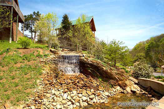 Waterfall landscape feature nearby at Alpine Sundance Trail, a 3 bedroom cabin rental located in Pigeon Forge
