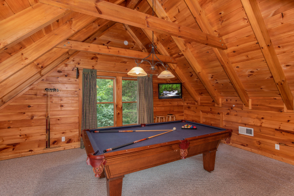 pool table in the loft space at alpine something blue a 1 bedroom cabin rental located in pigeon forge