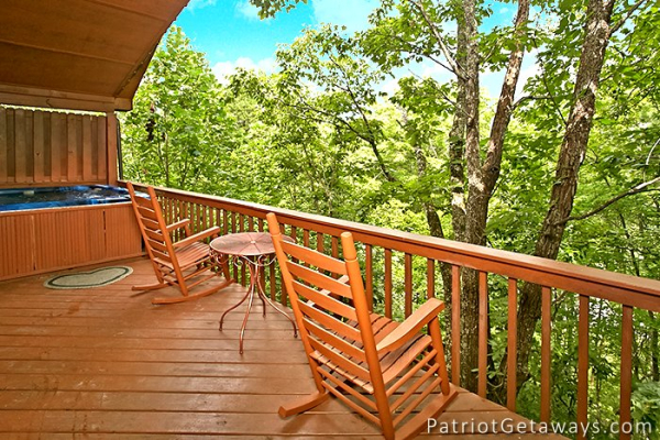 rocking chairs on the covered deck at always together forever a 1 bedroom cabin rental located in pigeon forge