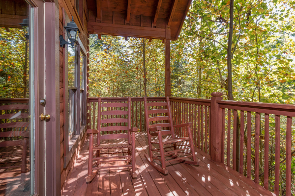 Porch rocking chairs at A Honeymoon Haven, a 1 bedroom cabin rental located in Gatlinburg