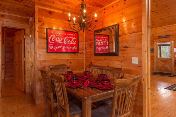 Dining room table for six at Moonshine Memories, a 2 bedroom cabin rental located in Gatlinburg