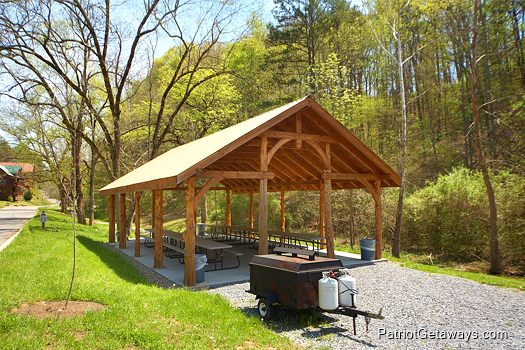 large picnic shelter with picnic tables in resort setting at alpine sunset thrill a 1 bedroom cabin rental located in pigeon forge