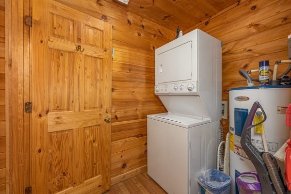 Stacked washer and dryer at Hidden Joy, a 1 bedroom cabin rental located in Gatlinburg