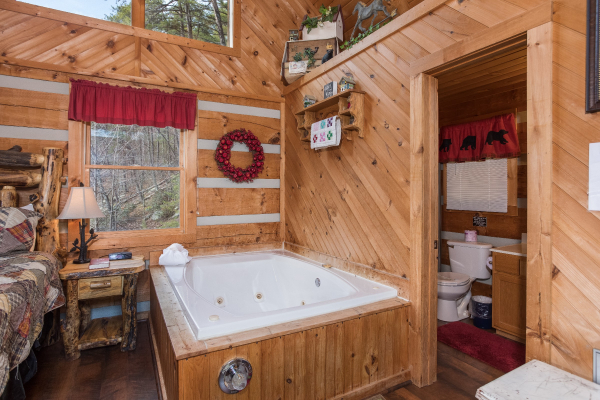 Jacuzzi in the bedroom at A Postcard View, a 1 bedroom cabin rental located in Pigeon Forge