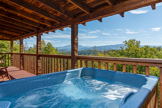 View from the hot tub on the covered deck at A Postcard View, a 1 bedroom cabin rental located in Pigeon Forge