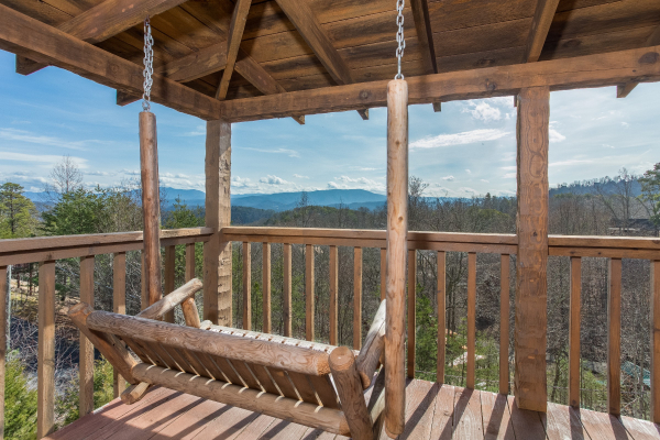 A mountain view from the porch swing at A Postcard View, a 1 bedroom cabin rental located in Pigeon Forge