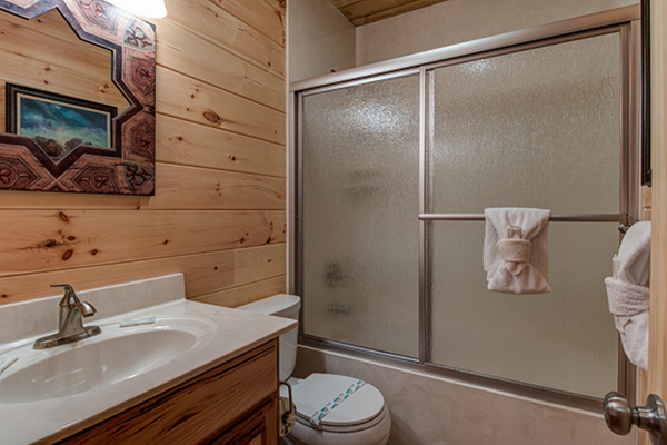 Bathroom on the first floor at Without A Paddle, a 3 bedroom cabin rental located in Gatlinburg
