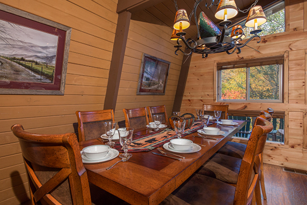 Dining table for 8 at Without A Paddle, a 3 bedroom cabin rental located in Gatlinburg