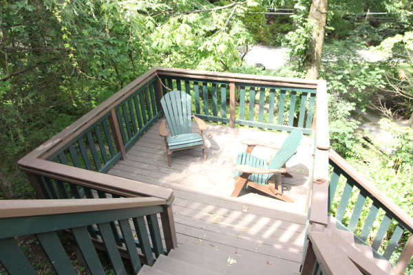 Lower level deck with two chairs at Without a Paddle, a 3 bedroom cabin rental located in Gatlinburg