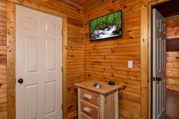 Dresser and TV in the bunkroom in cabin 1 at The Settlement, a 10 bedroom cabin rental located in Pigeon Forge
