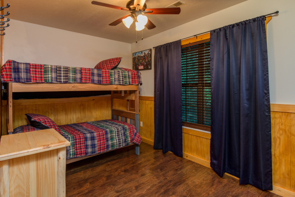 Bunk beds in a bedroom in cabin 1 at The Settlement, a 10 bedroom cabin rental located in Pigeon Forge