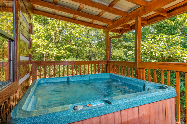 Hot tub at cabin 3 at The Settlement, a 10 bedroom cabin rental located in Pigeon Forge