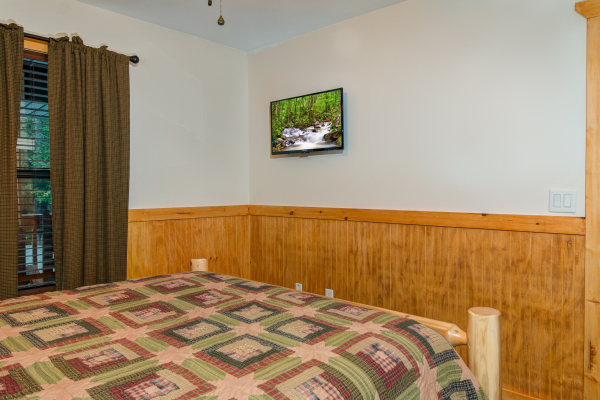 TV in the bedroom at cabin 1 at The Settlement, a 10 bedroom cabin rental located in Pigeon Forge