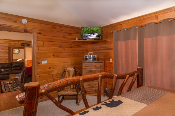 Dresser and TV in a bedroom at Just for Fun, a 4 bedroom cabin rental located in Pigeon Forge