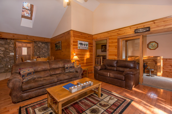 Sofa and loveseat in the living room at Just for Fun, a 4 bedroom cabin rental located in Pigeon Forge
