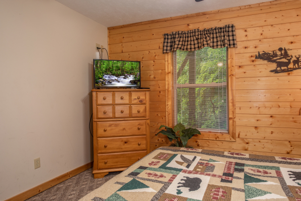 Chest of drawers and a TV in the bedroom at Into the Mist, a 3 bedroom cabin rental located in Pigeon Forge