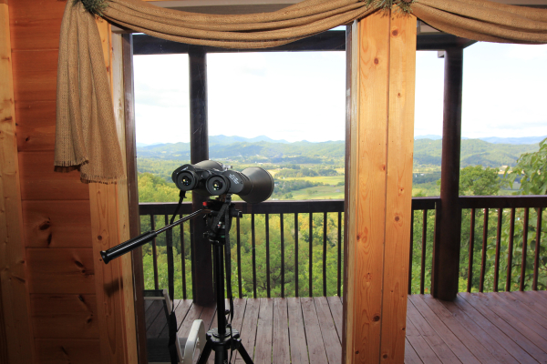 Binoculars mounted to look at the views at Hummingbird's Views, a 1 bedroom cabin rental located in Pigeon Forge