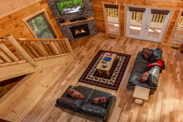 Looking down at the living room at Canyon Camp Falls, a 2 bedroom cabin rental located in Pigeon Forge