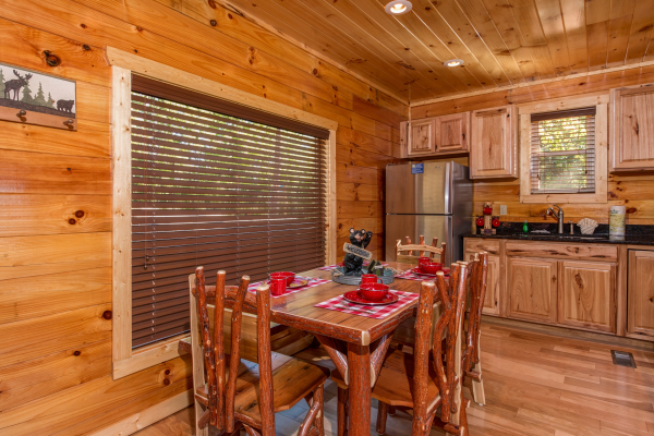 Dining table at Canyon Camp Falls, a 2 bedroom cabin rental located in Pigeon Forge
