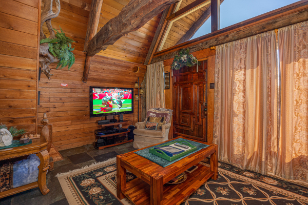 Coffee table and television at Ever After, a 1 bedroom cabin rental located in Gatlinburg