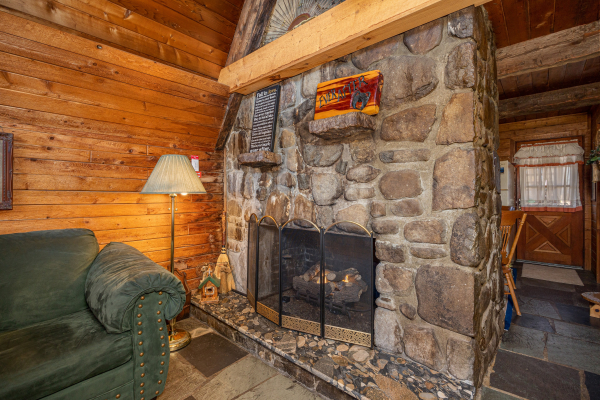 Stone fireplace at Ever After, a 1 bedroom cabin rental located in Gatlinburg