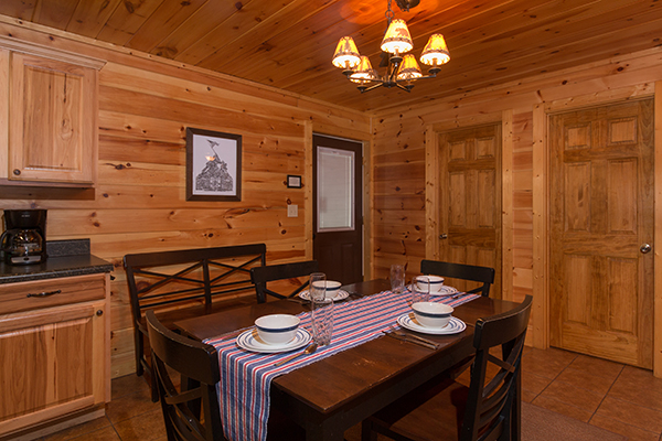 Dining space for four at Rustic Romance, a 2 bedroom cabin rental located in Pigeon Forge