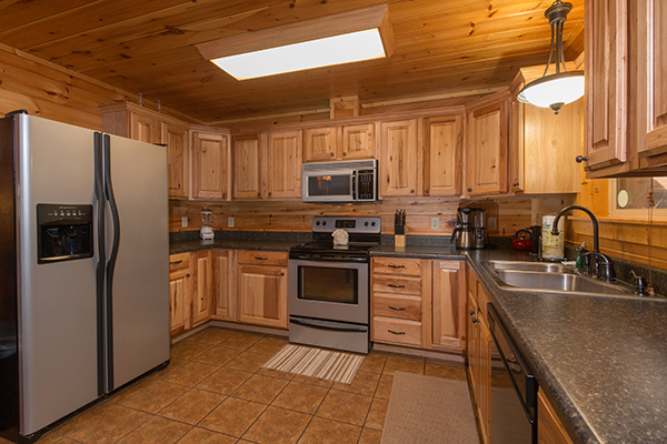 Kitchen with stainless appliances at Rustic Romance, a 2 bedroom cabin rental located in Pigeon Forge