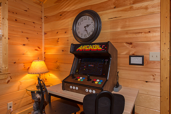 Table top arcade game in the living room at Rustic Romance, a 2 bedroom cabin rental located in Pigeon Forge
