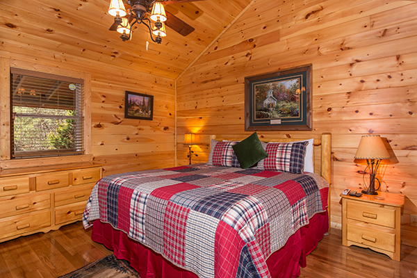 Bedroom with a king bed at Rustic Romance, a 2 bedroom cabin rental located in Pigeon Forge