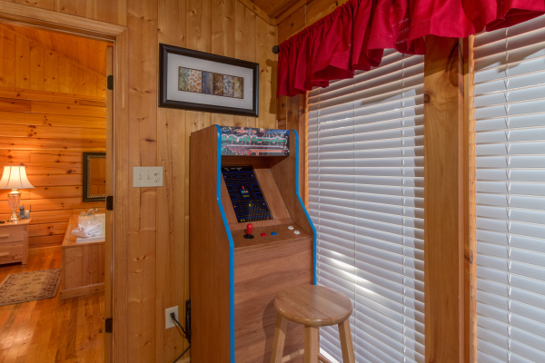Arcade game at A Beary Cozy Escape, a 1 bedroom cabin rental located in Pigeon Forge