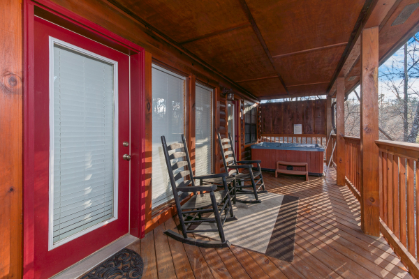 Lower porch and hot tub at A Beary Cozy Escape, a 1 bedroom cabin rental located in Pigeon Forge