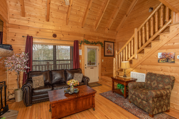 Seating in the living room at Let the Good Times Roll, a 2 bedroom cabin rental located in Pigeon Forge