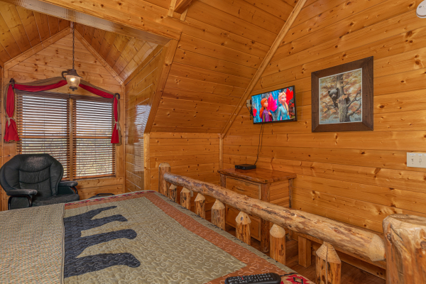 Bedroom with bear bedding at Grand Timber Lodge, a 5-bedroom cabin rental located in Pigeon Forge