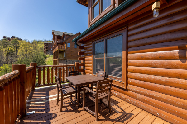 Deck seating  at Grand Timber Lodge, a 5-bedroom cabin rental located in Pigeon Forge