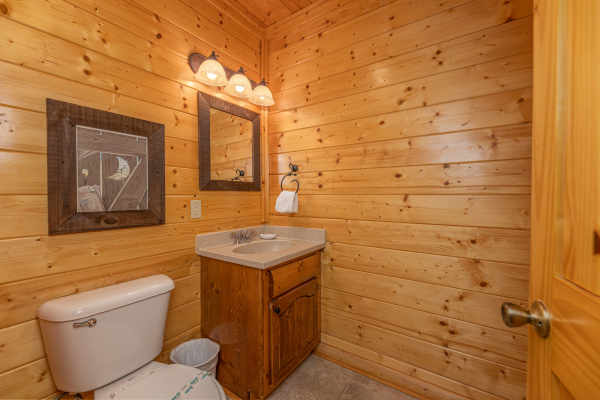 Game room bathroom at Grand Timber Lodge, a 5-bedroom cabin rental located in Pigeon Forge