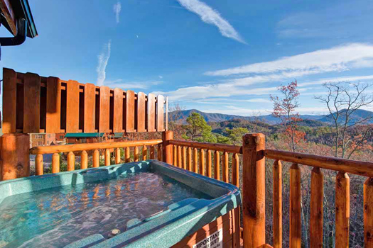Hot tub views in the fall at Grand Timber Lodge, a 5-bedroom cabin rental located in Pigeon Forge