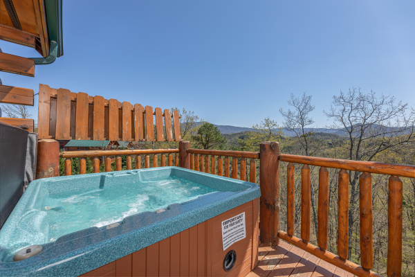 Hot tub with mountain view at Grand Timber Lodge, a 5-bedroom cabin rental located in Pigeon Forge