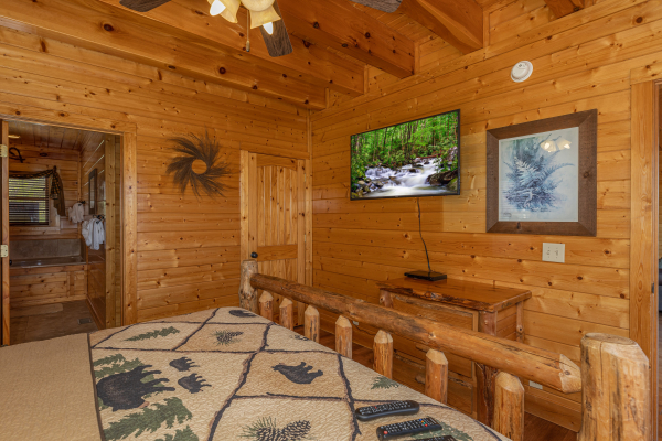 Log bed and amenities  at Grand Timber Lodge, a 5-bedroom cabin rental located in Pigeon Forge