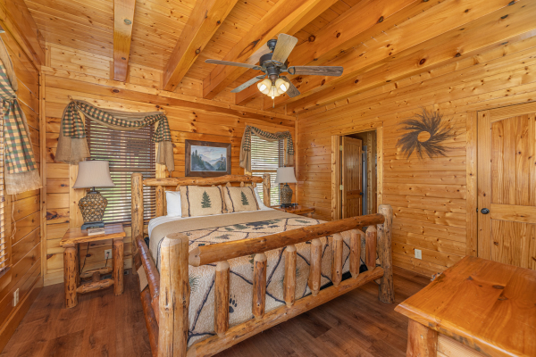 Log style bed  at Grand Timber Lodge, a 5-bedroom cabin rental located in Pigeon Forge