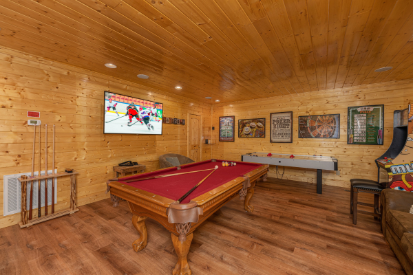 Pool table at Grand Timber Lodge, a 5-bedroom cabin rental located in Pigeon Forge