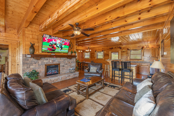 Flat screen and fireplace  at Grand Timber Lodge, a 5-bedroom cabin rental located in Pigeon Forge