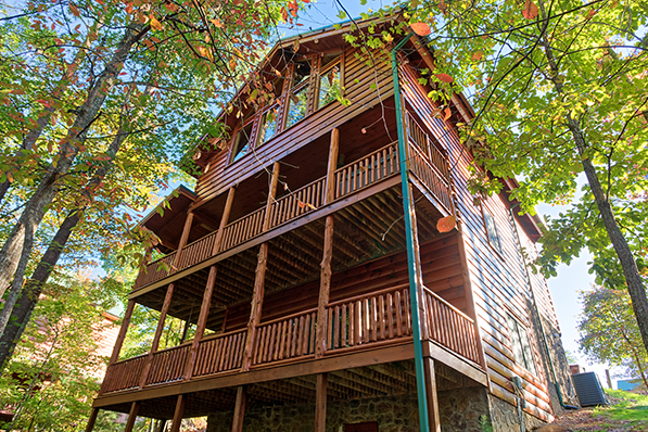 Looking up at two levels of deck at Bearfoot Paradise, a 3-bedroom cabin rental located in Pigeon Forge
