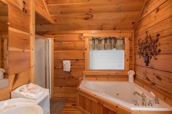 Jacuzzi in the corner of a bathroom at Pigeon Forge View, a 6 bedroom cabin rental located in Pigeon Forge