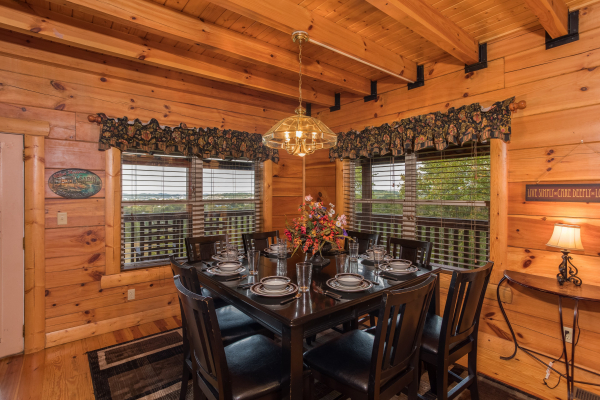 Dining table for eight at Pigeon Forge View, a 6 bedroom cabin rental located in Pigeon Forge