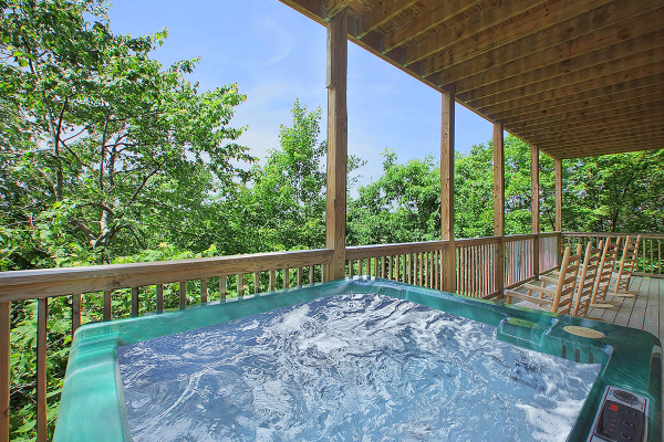 Wooded views from the hot tub at Pigeon Forge View, a 6 bedroom cabin rental located in Pigeon Forge