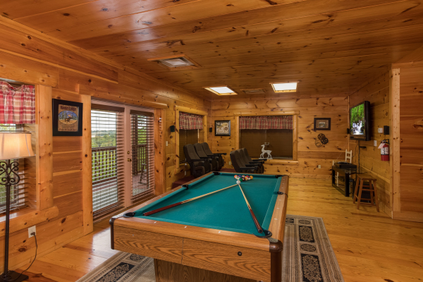 Pool table in the game room at Pigeon Forge View, a 6 bedroom cabin rental located in Pigeon Forge