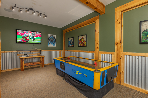 Air hockey table at Smokies Paradise Lodge, a 5 bedroom cabin rental located in Pigeon Forge