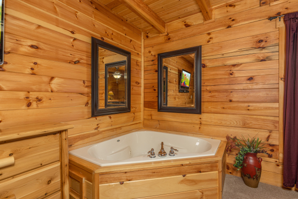 Jacuzzi in a bedroom at Smokies Paradise Lodge, a 5 bedroom cabin rental located in Pigeon Forge