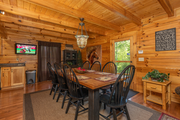 Dining table for 8 at Smokies Paradise Lodge, a 5 bedroom cabin rental located in Pigeon Forge